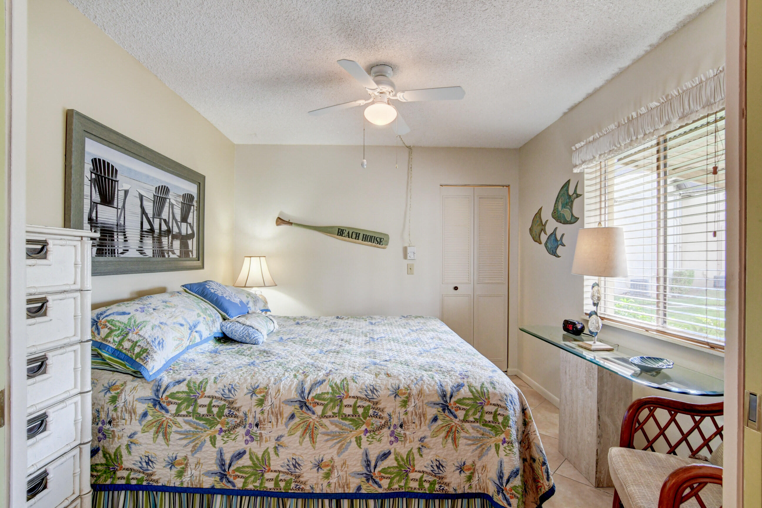 334 Pine Ridge Circle, Unit B1 Greenacres, FL 33463 - Photo 17 of 26 a bedroom with a large bed and a window