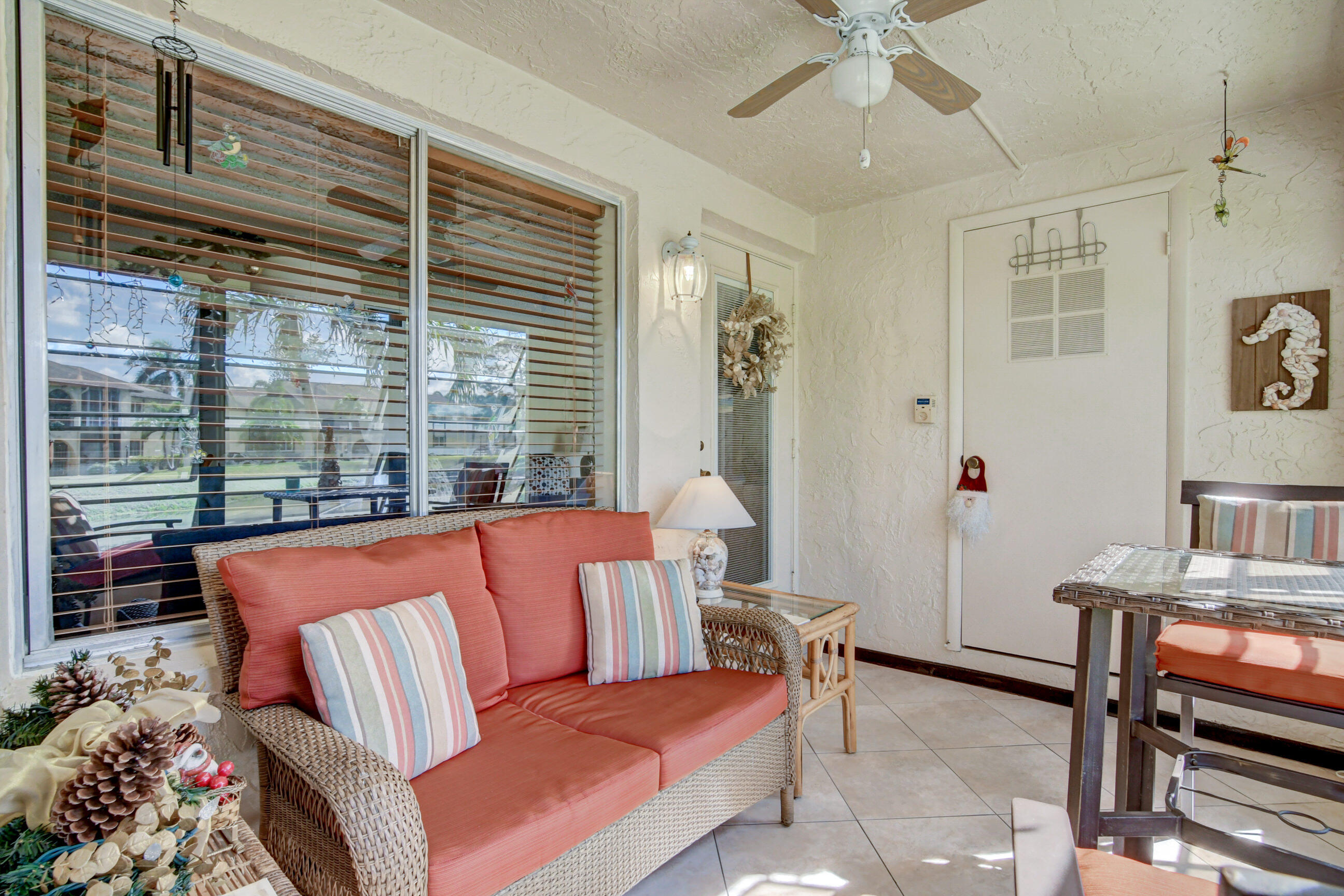 334 Pine Ridge Circle, Unit B1 Greenacres, FL 33463 - Photo 4 of 26 a living room with furniture and a window