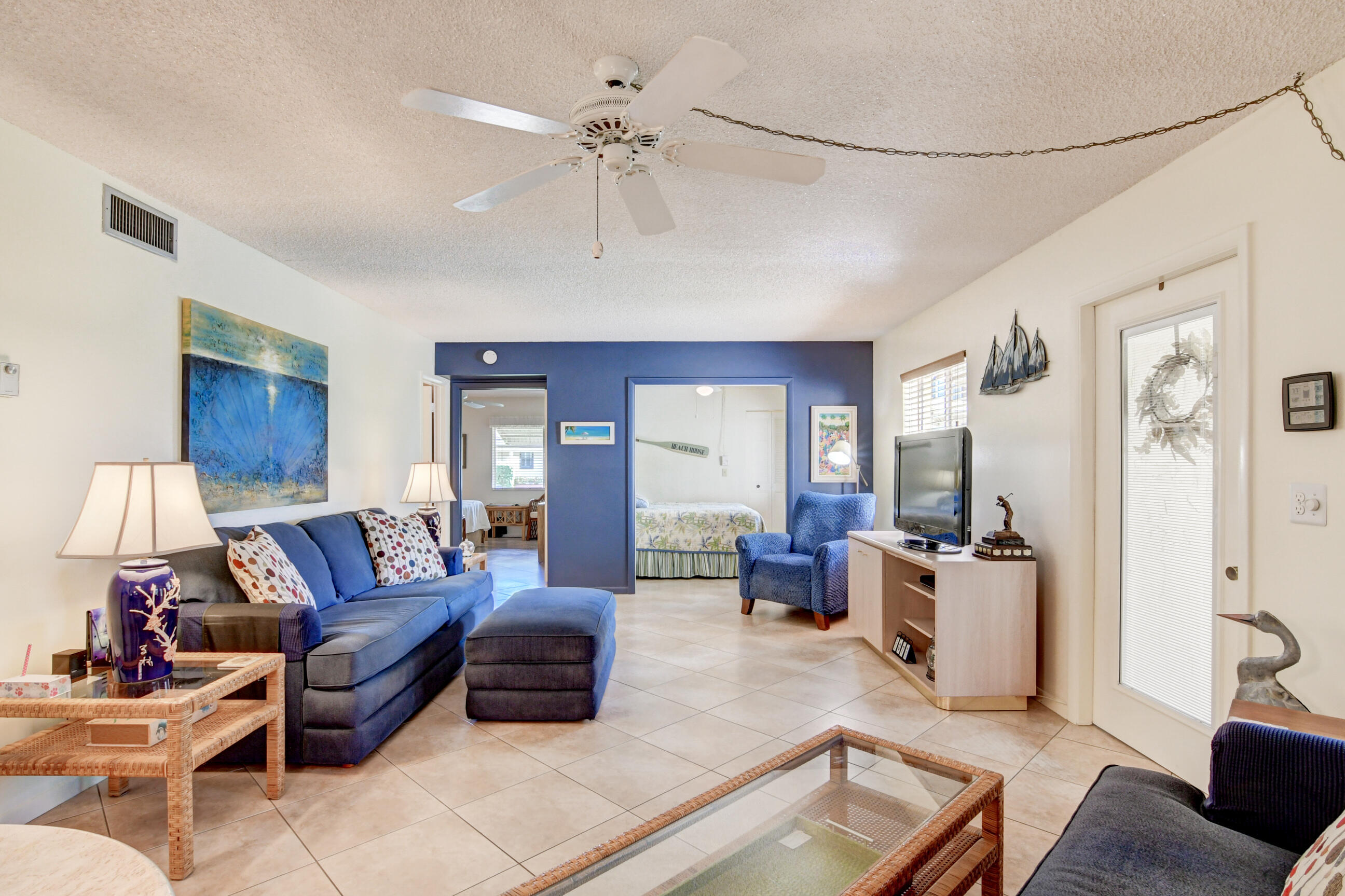 334 Pine Ridge Circle, Unit B1 Greenacres, FL 33463 - Photo 6 of 26 a living room with furniture and wooden floor