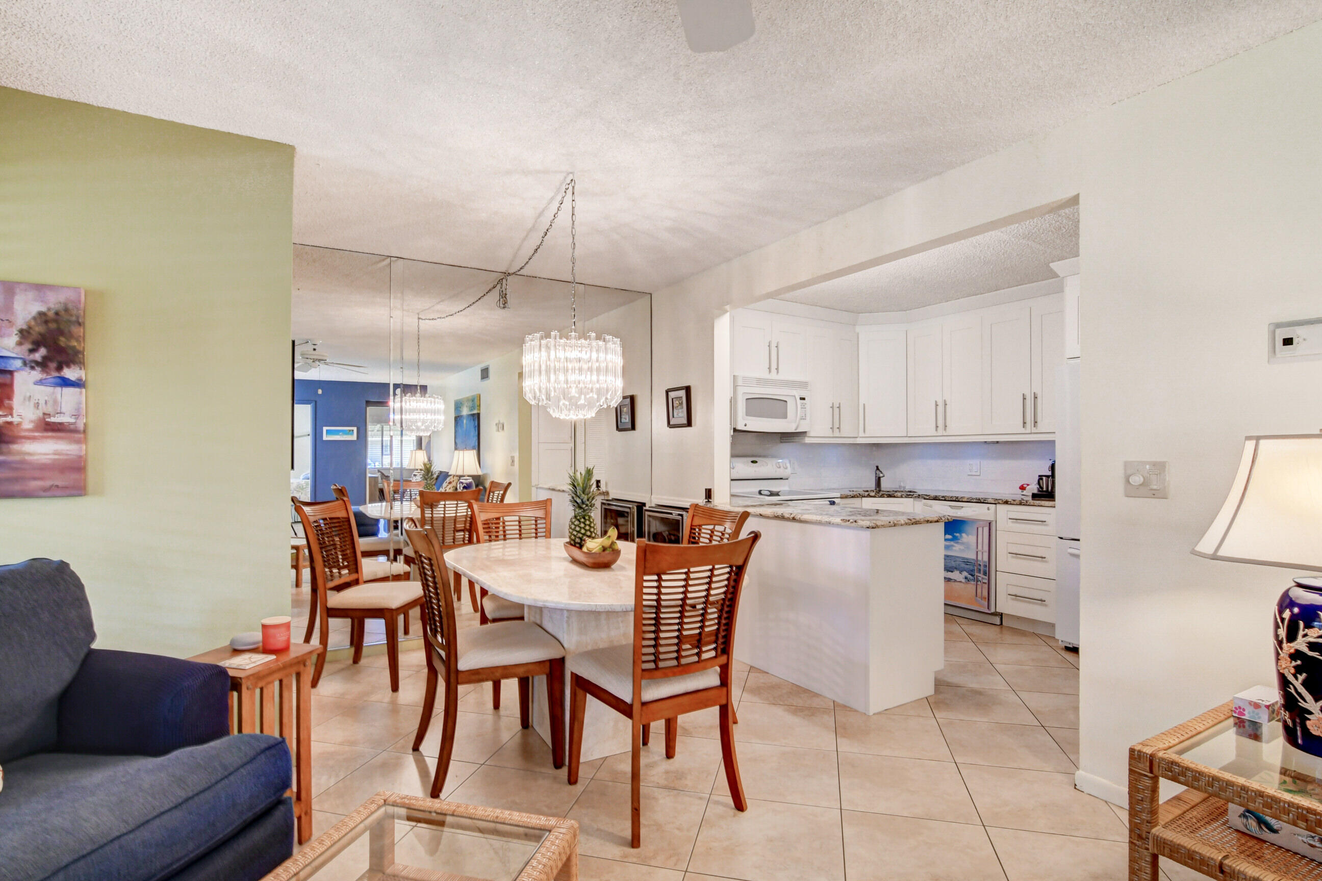 334 Pine Ridge Circle, Unit B1 Greenacres, FL 33463 - Photo 8 of 26 a view of a dining room with furniture