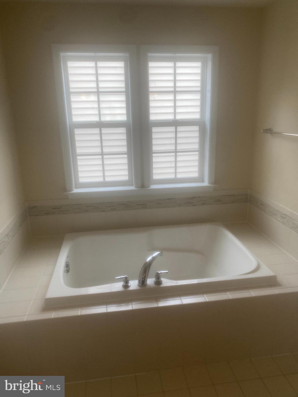 9509 Manor Oaks View Upper Marlboro, MD 20772 - Photo 12 of 20 a white bath tub sitting next to a window