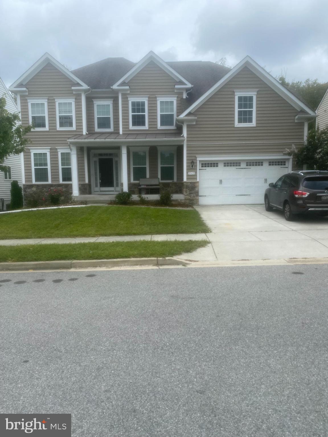 9509 Manor Oaks View Upper Marlboro, MD 20772 - Photo 2 of 20 a front view of a house with a yard