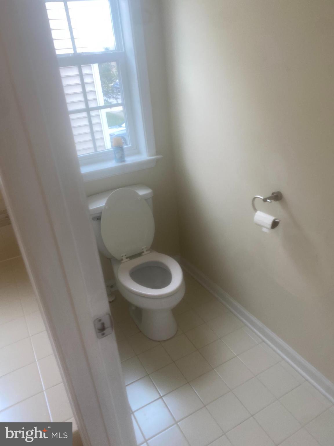 9509 Manor Oaks View Upper Marlboro, MD 20772 - Photo 8 of 20 a white toilet sitting next to a window