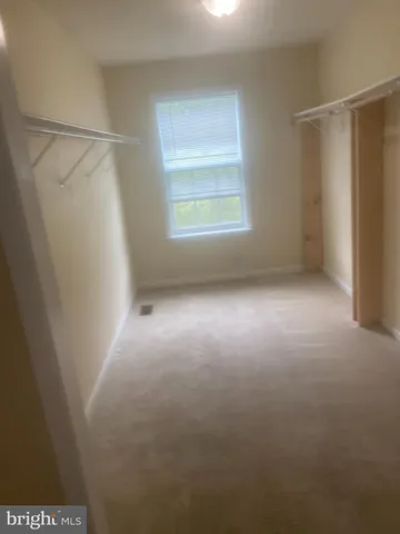 a view of empty room with windows