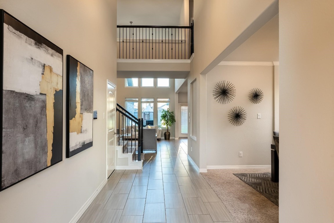 3443 Cabernet Shores Drive Fulshear, TX 77441 - Photo 15 of 27 a view of a hallway view with wooden floor and staircase