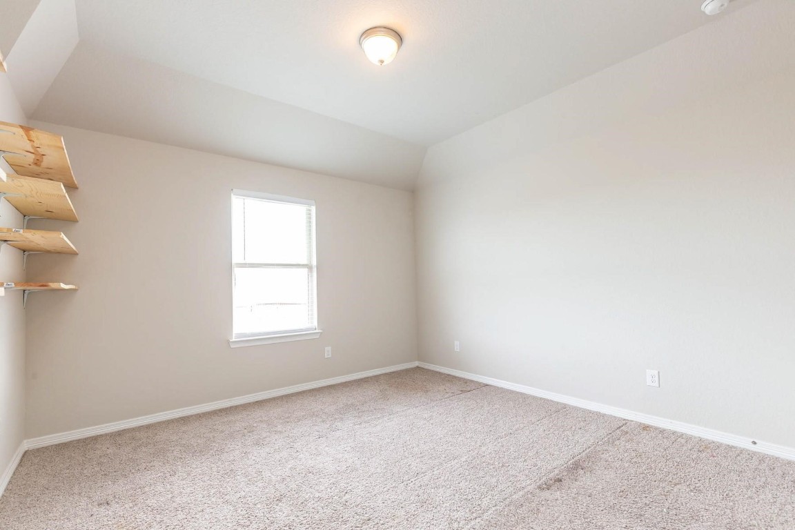 3443 Cabernet Shores Drive Fulshear, TX 77441 - Photo 20 of 27 an empty room with a window
