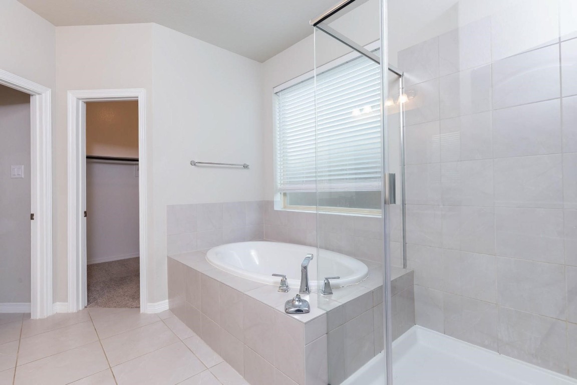 3443 Cabernet Shores Drive Fulshear, TX 77441 - Photo 25 of 27 a white bath tub sitting in a bathroom