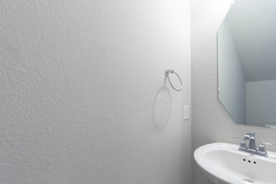 3443 Cabernet Shores Drive Fulshear, TX 77441 - Photo 26 of 27 a bathroom with a sink and mirror