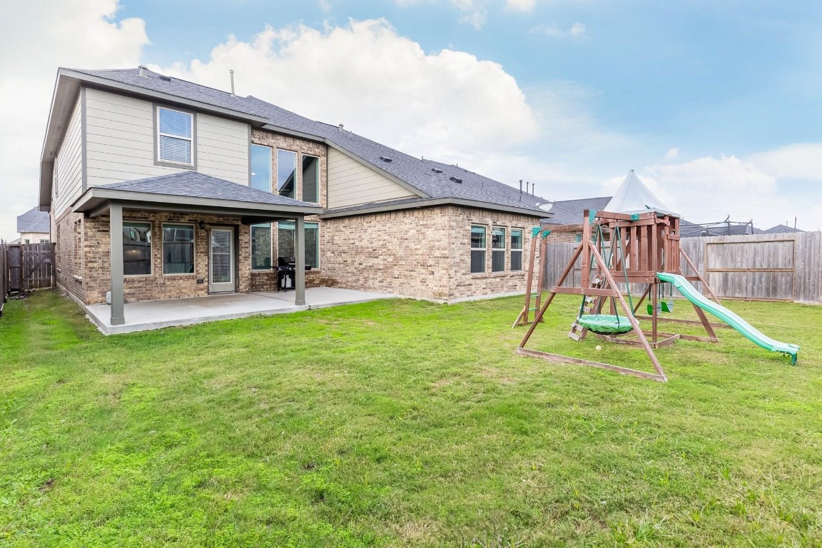 3443 Cabernet Shores Drive Fulshear, TX 77441 - Photo 27 of 27 a house view with a garden space and swimming pool
