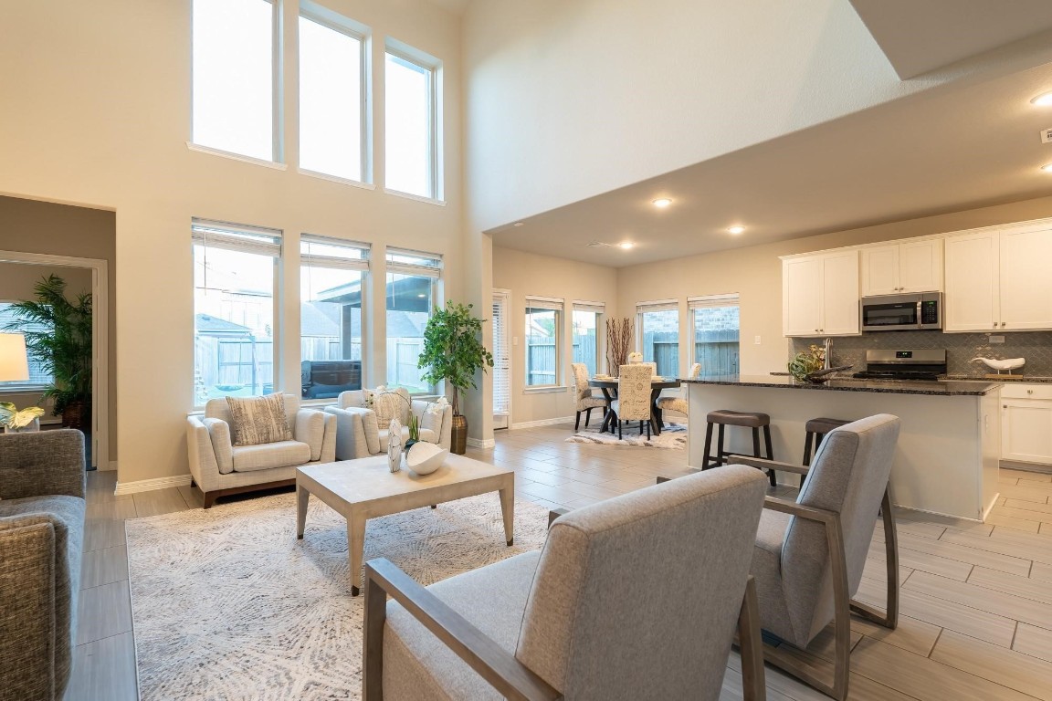3443 Cabernet Shores Drive Fulshear, TX 77441 - Photo 4 of 27 a living room with furniture and a large window