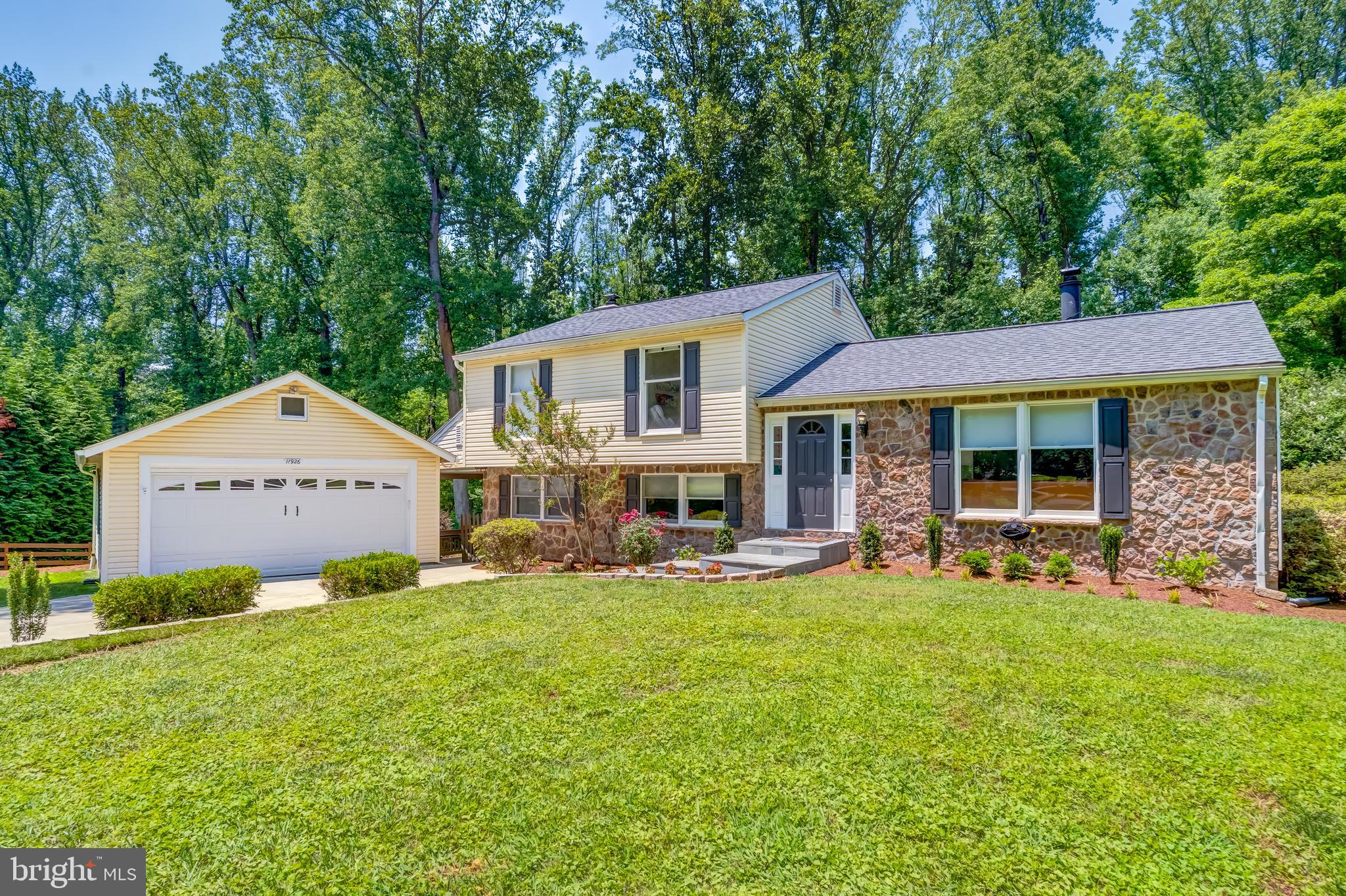 11926 Appling Valley Road Fairfax, VA 22030 - Photo 1 of 60 a front view of a house with a yard and porch