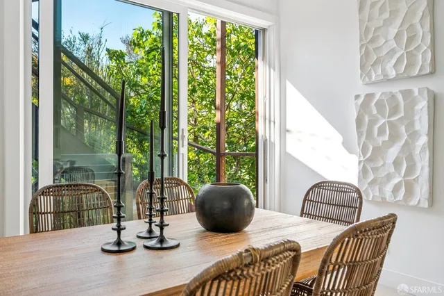 a view of a dining room with furniture window and outside view
