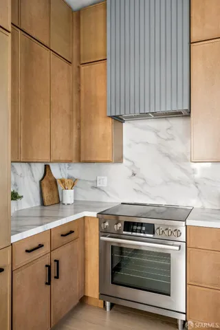 a view of a kitchen with a sink and cabinets