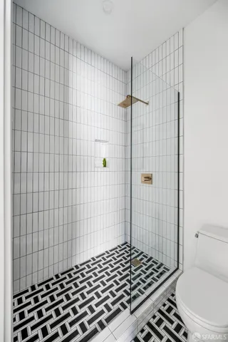 a view of walk in closet with clothes