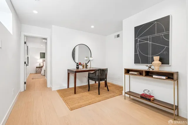 a bedroom with furniture and a window
