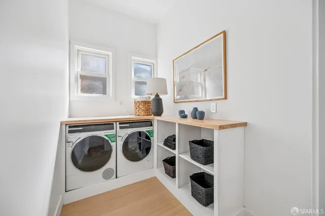 a view of a house with a tree beside it