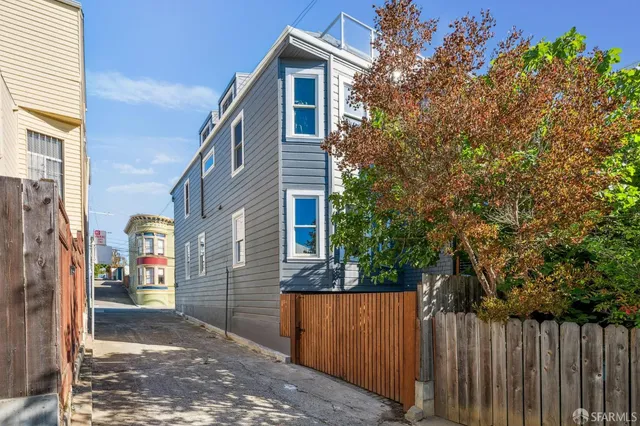 a view of a house with a door and wooden floor