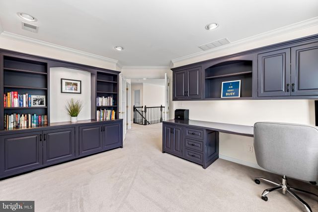 a spacious bedroom with a bed and a table