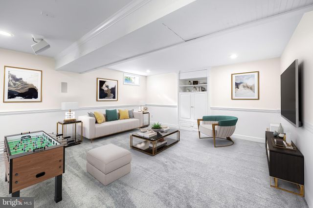 a view of a porch with furniture and a yard