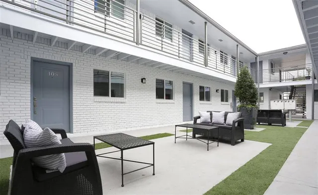 a building outdoor space with patio furniture