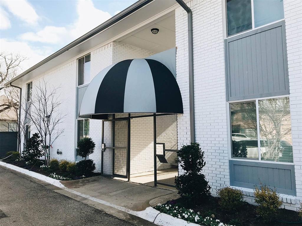404 East 9th Street, Unit 8102 Dallas, TX 75203 - Photo 15 of 15 a view of a house with a yard