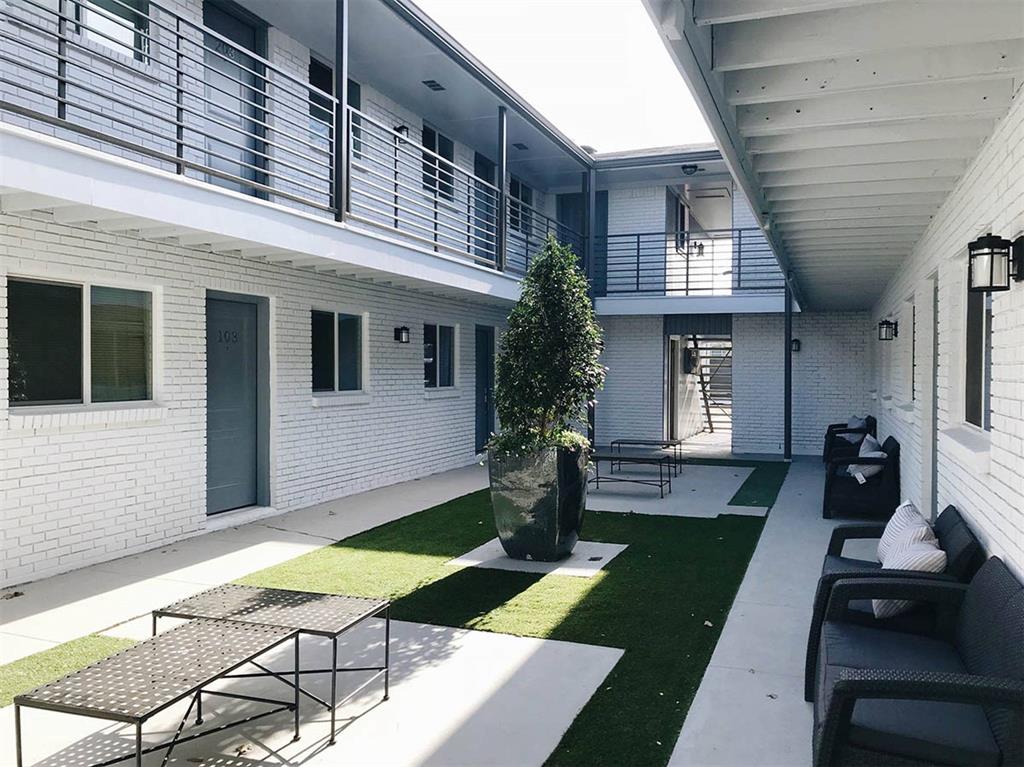 404 East 9th Street, Unit 8102 Dallas, TX 75203 - Photo 2 of 15 a front view of a house with garden