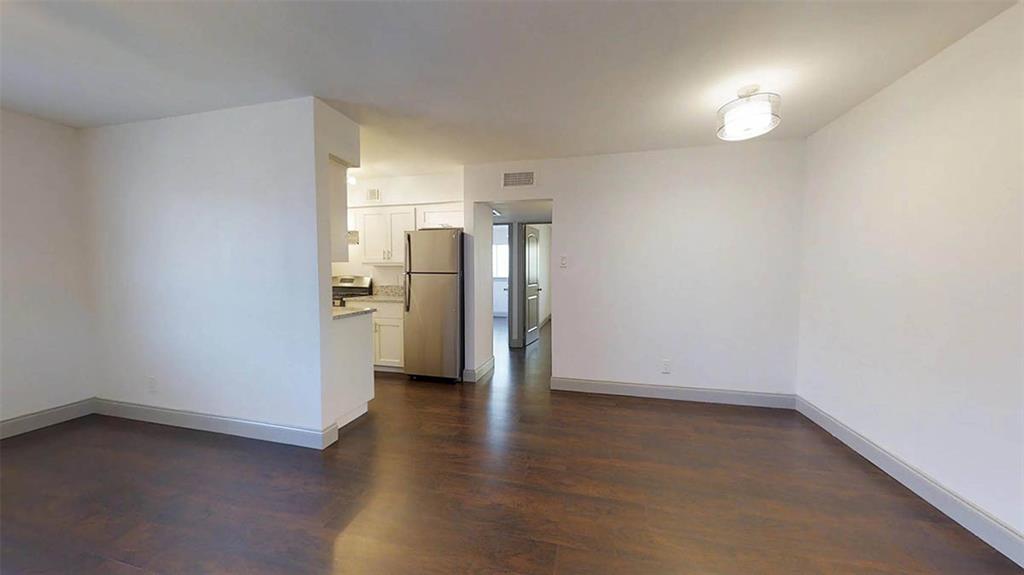 404 East 9th Street, Unit 8102 Dallas, TX 75203 - Photo 9 of 15 a view of a kitchen with a sink and refrigerator