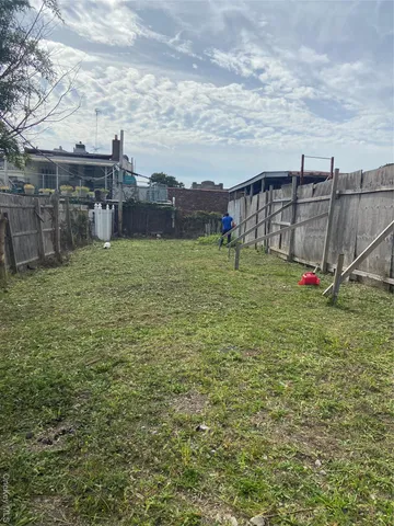 an aerial view of houses with outdoor space