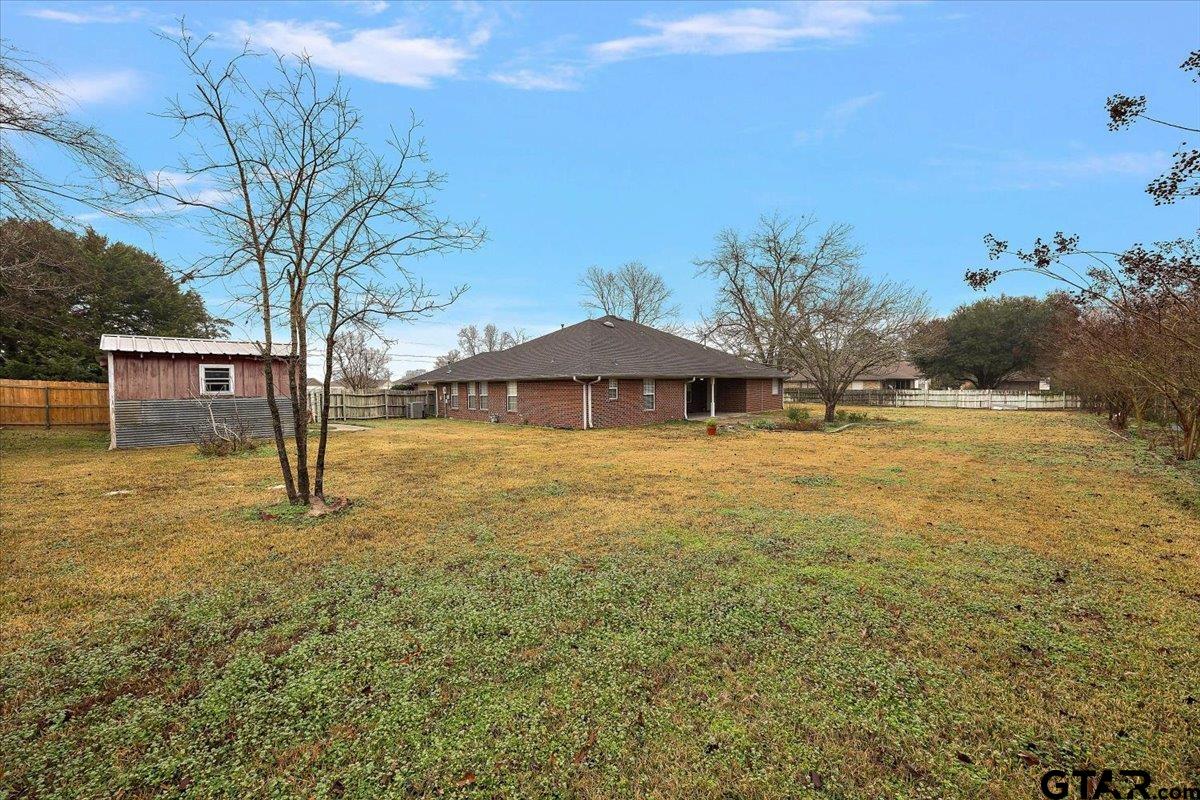 142 Parrish Rusk, TX 75785 - Photo 35 of 43 a backyard of a house with table and chairs