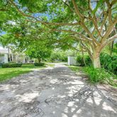 a view of house with yard and green space