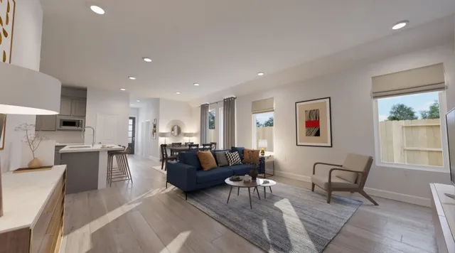 a view of a patio with table and chairs