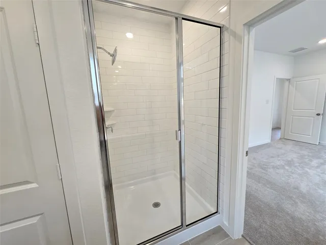 an aerial view of residential houses with outdoor space and ocean view