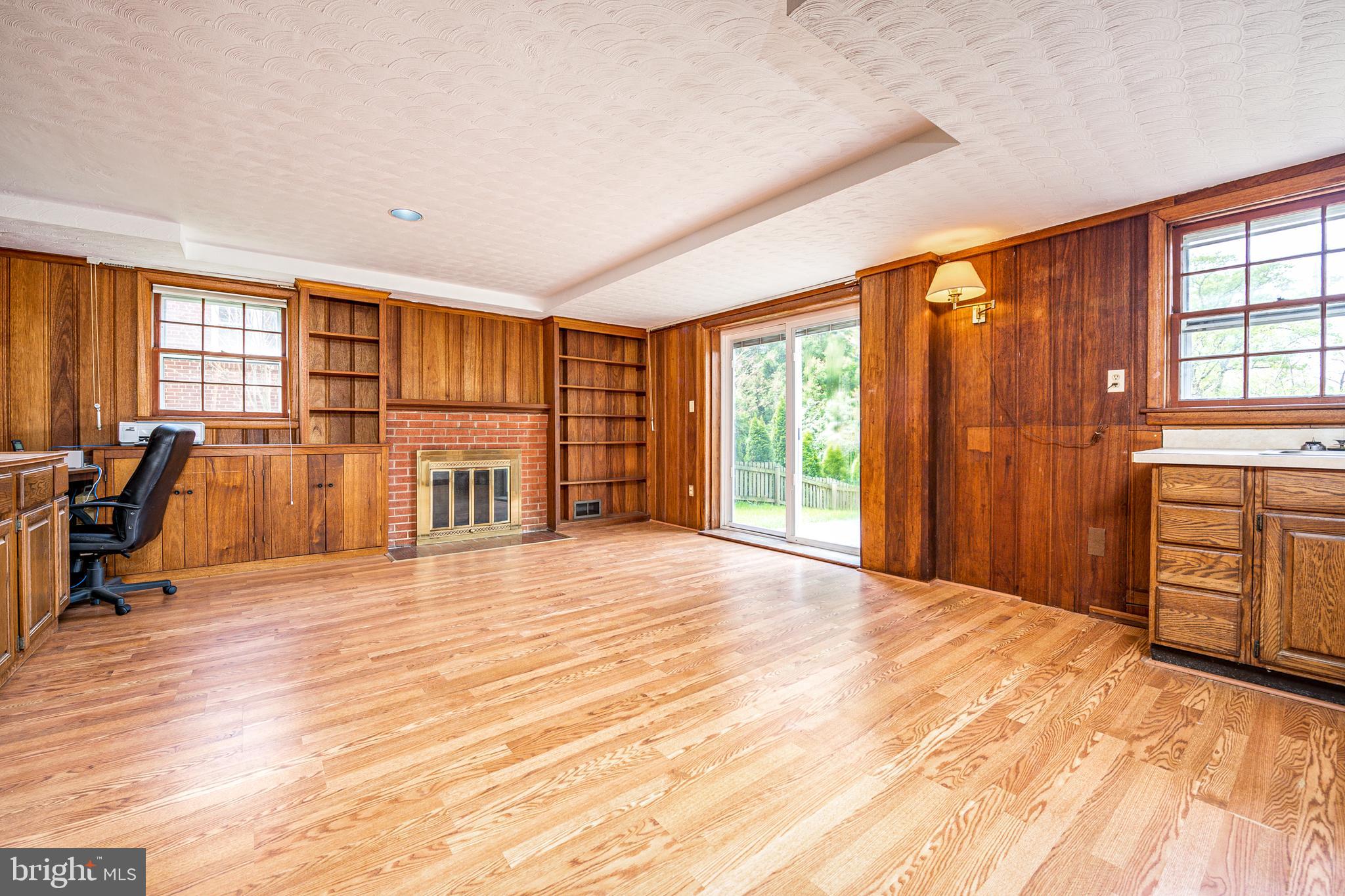9914 Old Spring Road Kensington, MD 20895 - Photo 24 of 34 Rec room with fireplace and walk out
