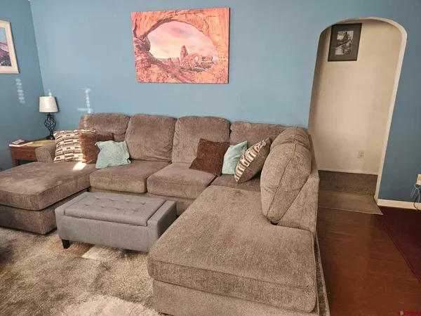a living room with couches and a couch