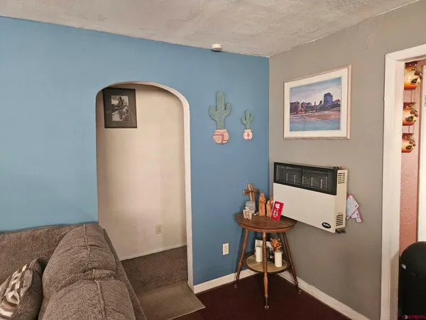 a view of a bedroom with bed and workspace