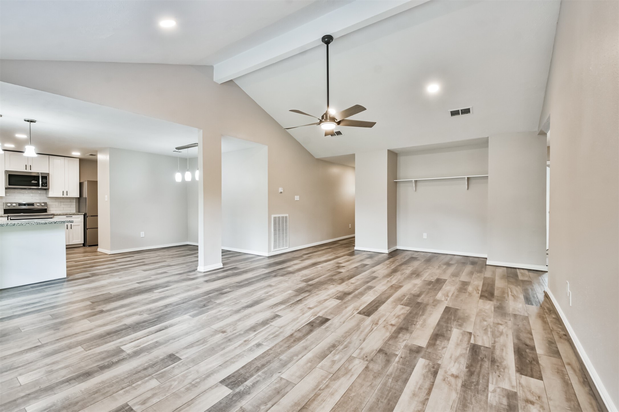6103 Fallengate Drive Spring, TX 77373 - Photo 13 of 36 a view of empty room with wooden floor and ceiling fan