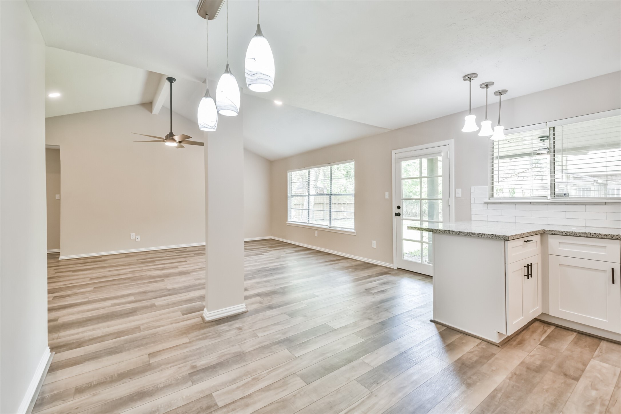 6103 Fallengate Drive Spring, TX 77373 - Photo 25 of 36 a view of a kitchen with wooden floor and a window