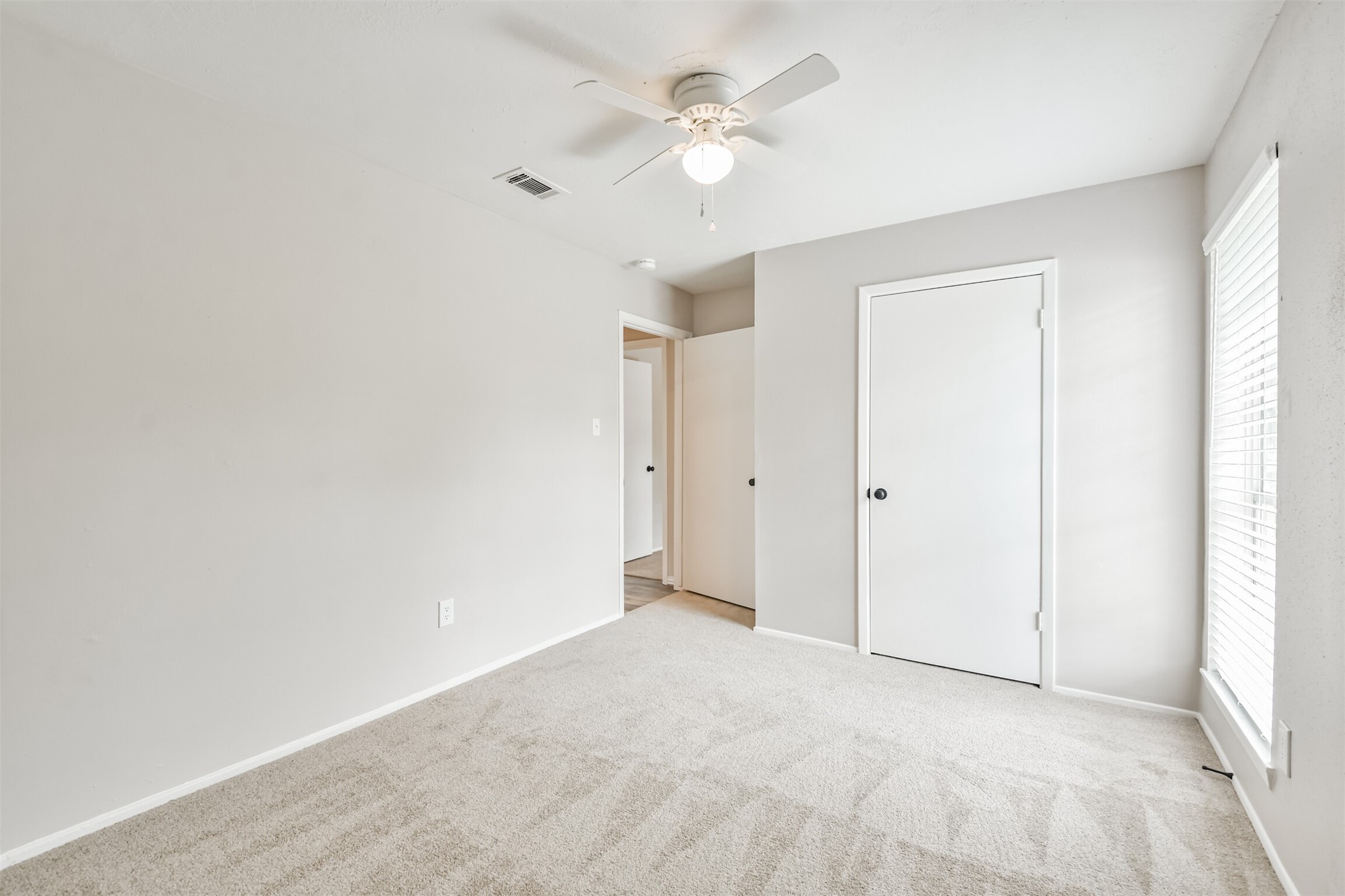 6103 Fallengate Drive Spring, TX 77373 - Photo 36 of 36 an empty room with a ceiling fan and a window