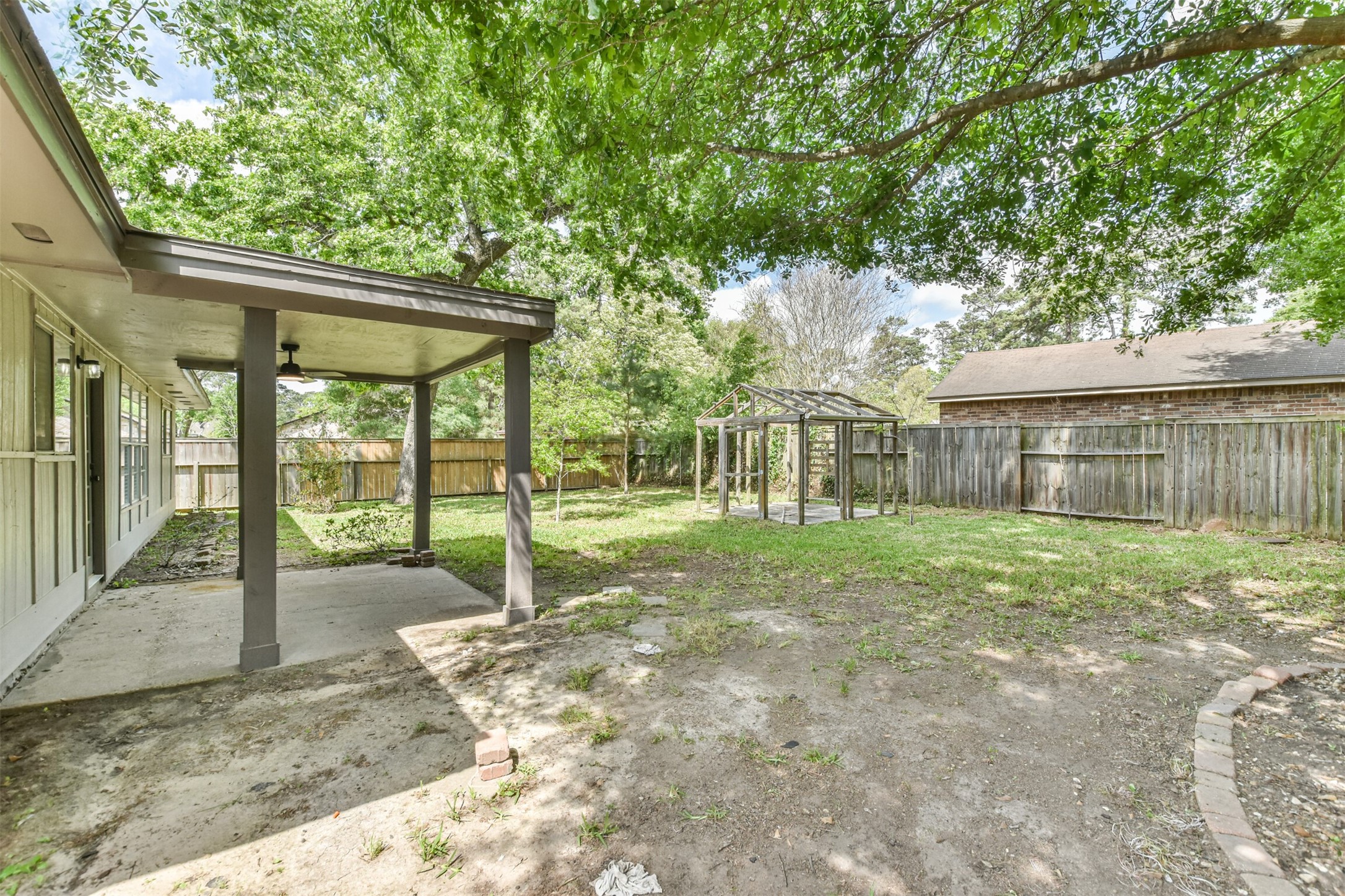 6103 Fallengate Drive Spring, TX 77373 - Photo 9 of 36 a view of a house with backyard and a large tree