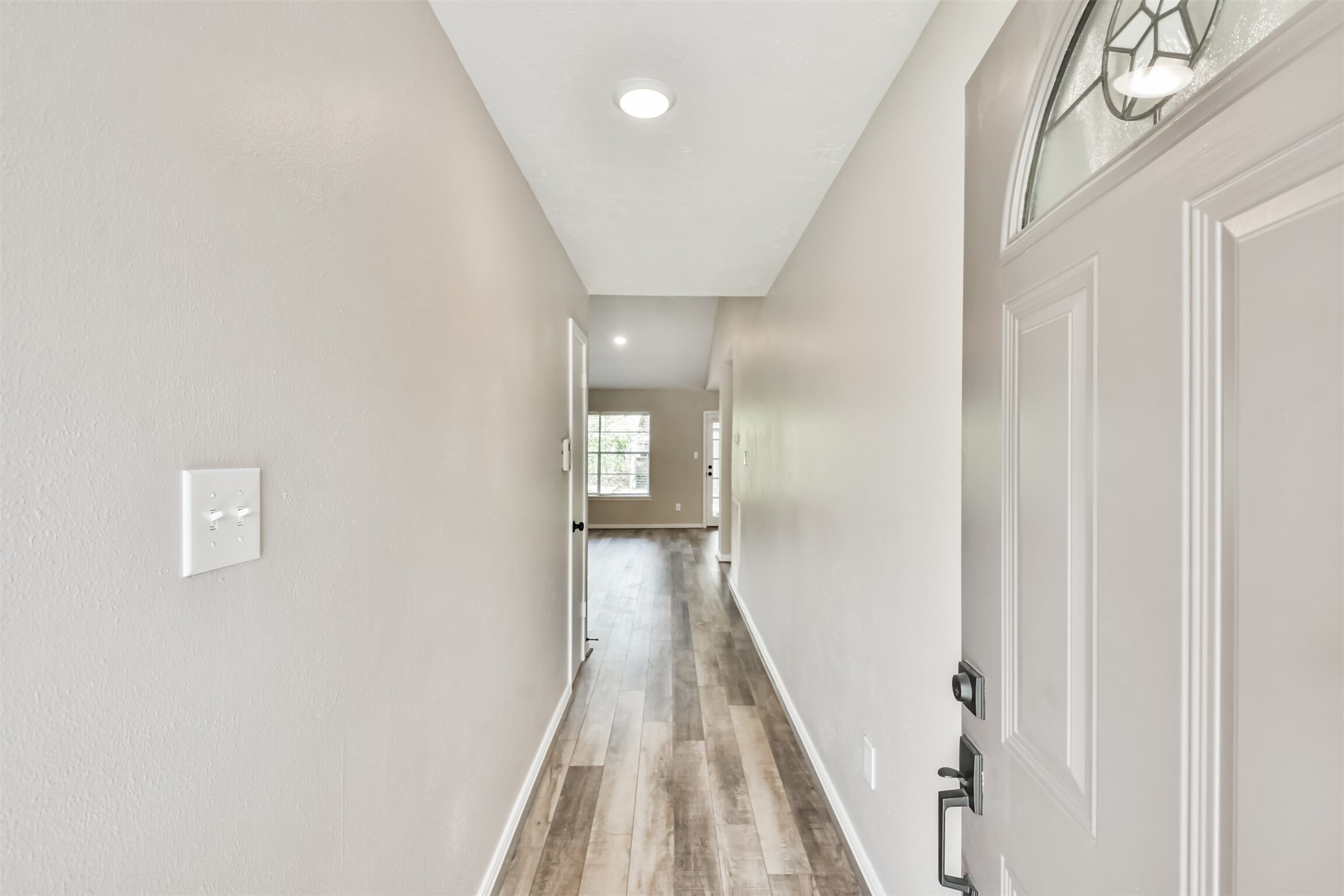6103 Fallengate Drive Spring, TX 77373 - Photo 10 of 36 a view of a hallway with wooden floor