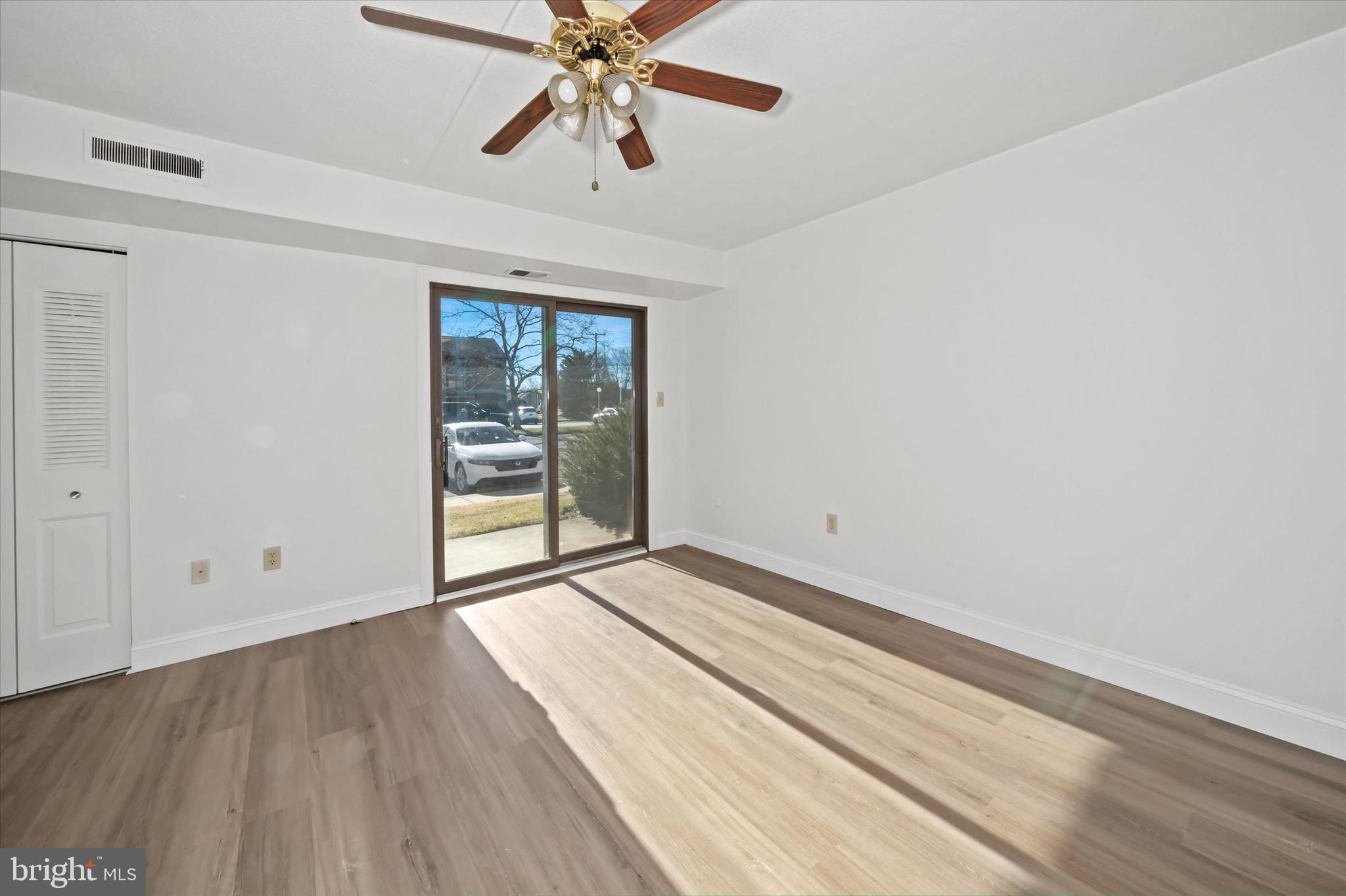 1 Berwyn Hall Dover, DE 19904 - Photo 4 of 16 wooden floor in an empty room with a window