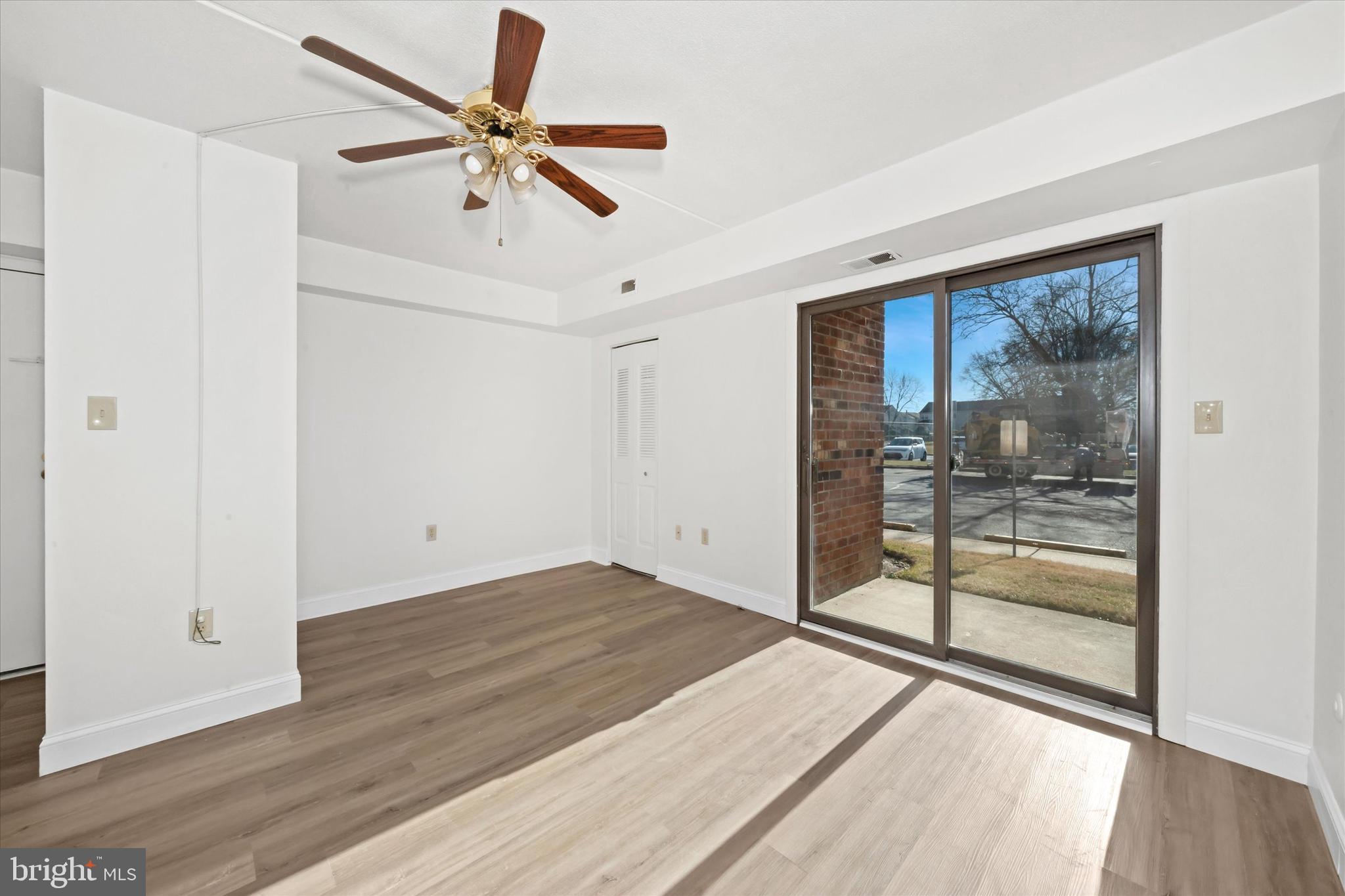 1 Berwyn Hall Dover, DE 19904 - Photo 6 of 16 an empty room with wooden floor and door