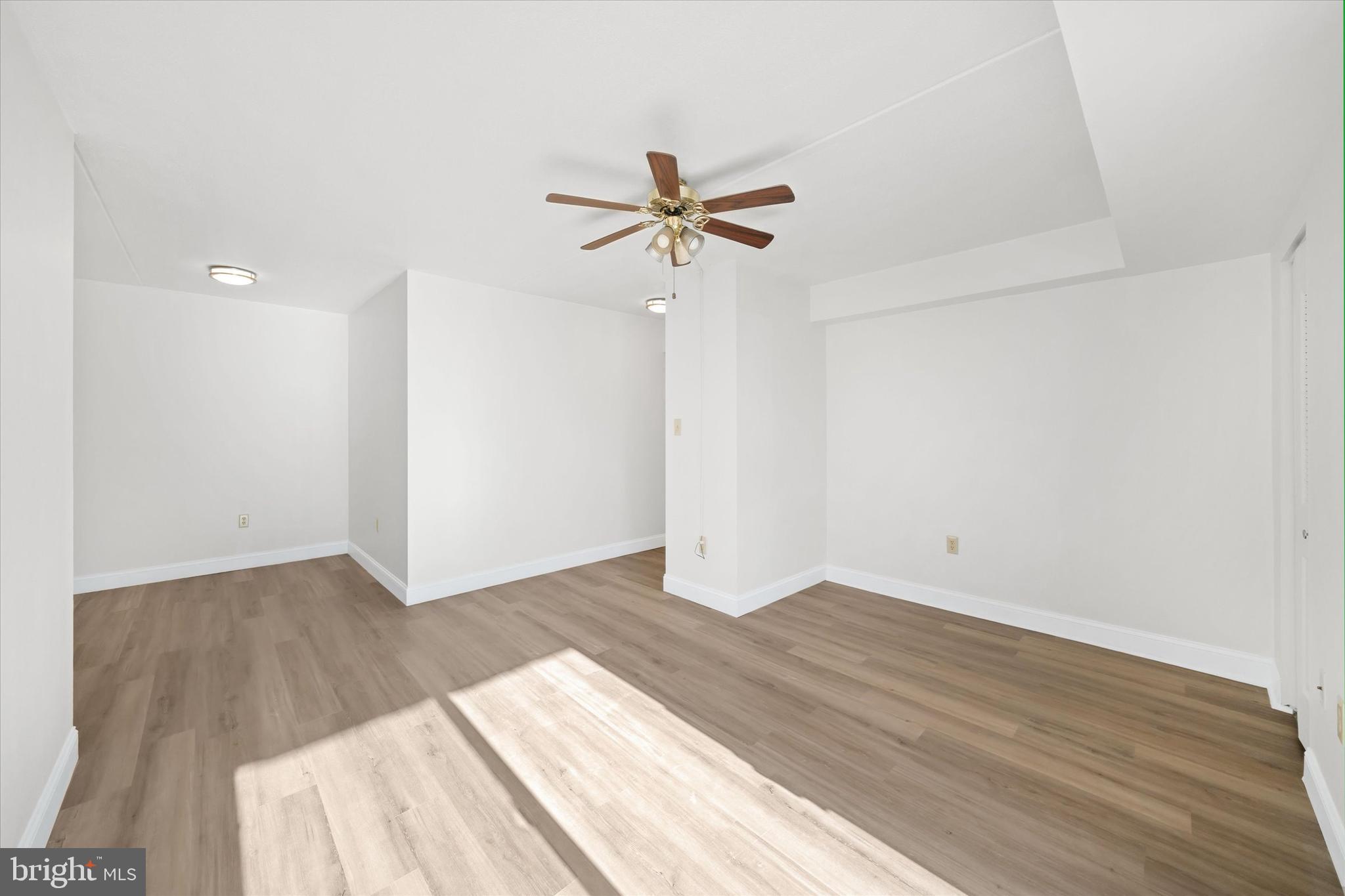 1 Berwyn Hall Dover, DE 19904 - Photo 8 of 16 a view of a room with wooden floor and a ceiling fan