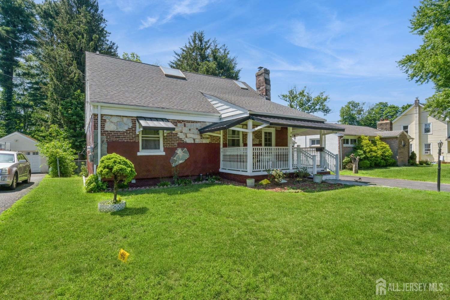 571 Greenbrook Road North Plainfield, NJ 07063 - Photo 1 of 28 a view of a house with a backyard and a garden