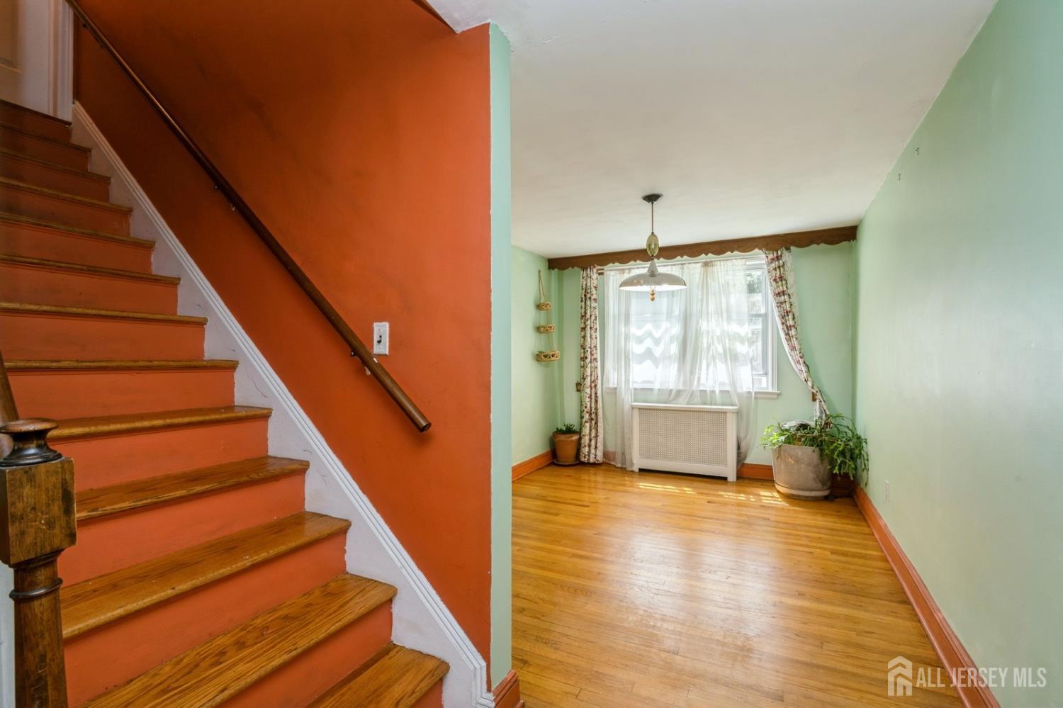 571 Greenbrook Road North Plainfield, NJ 07063 - Photo 11 of 28 a view of an entryway with wooden floor and front door