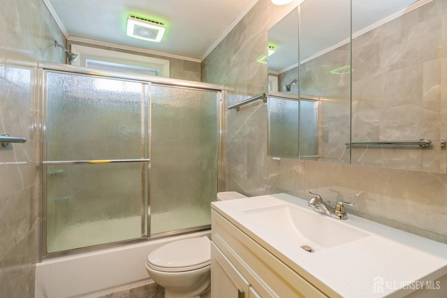 571 Greenbrook Road North Plainfield, NJ 07063 - Photo 14 of 28 a bathroom with a sink toilet and shower