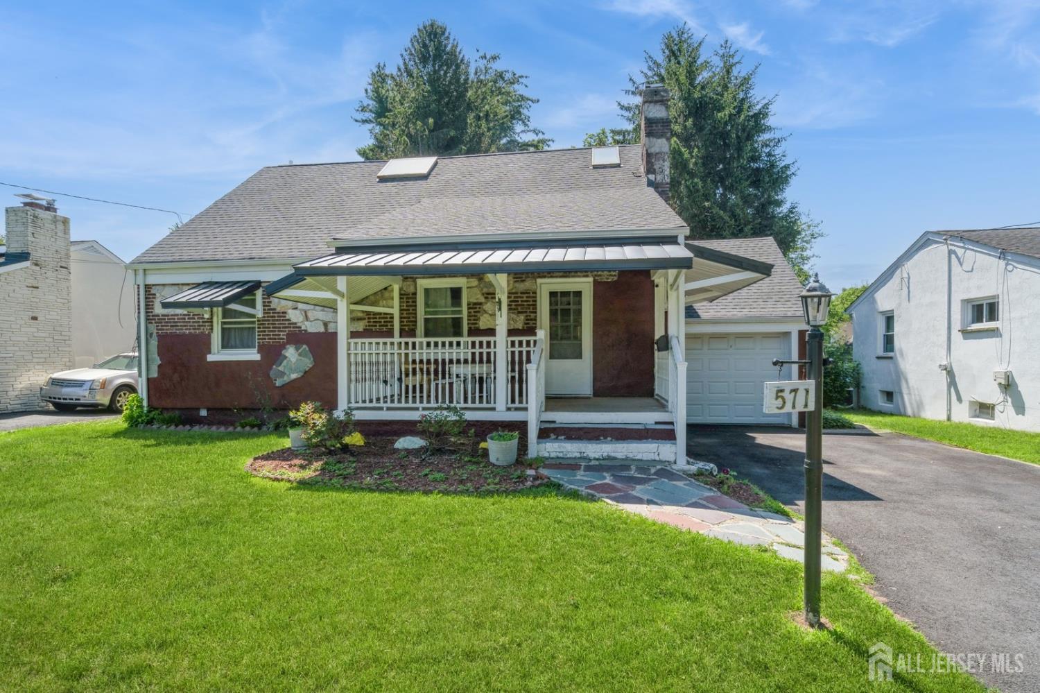 571 Greenbrook Road North Plainfield, NJ 07063 - Photo 2 of 28 a view of a house with a yard and plants