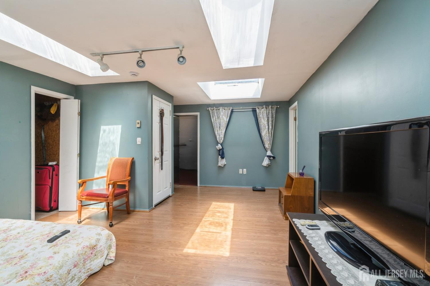 571 Greenbrook Road North Plainfield, NJ 07063 - Photo 21 of 28 a living room with furniture and a flat screen tv