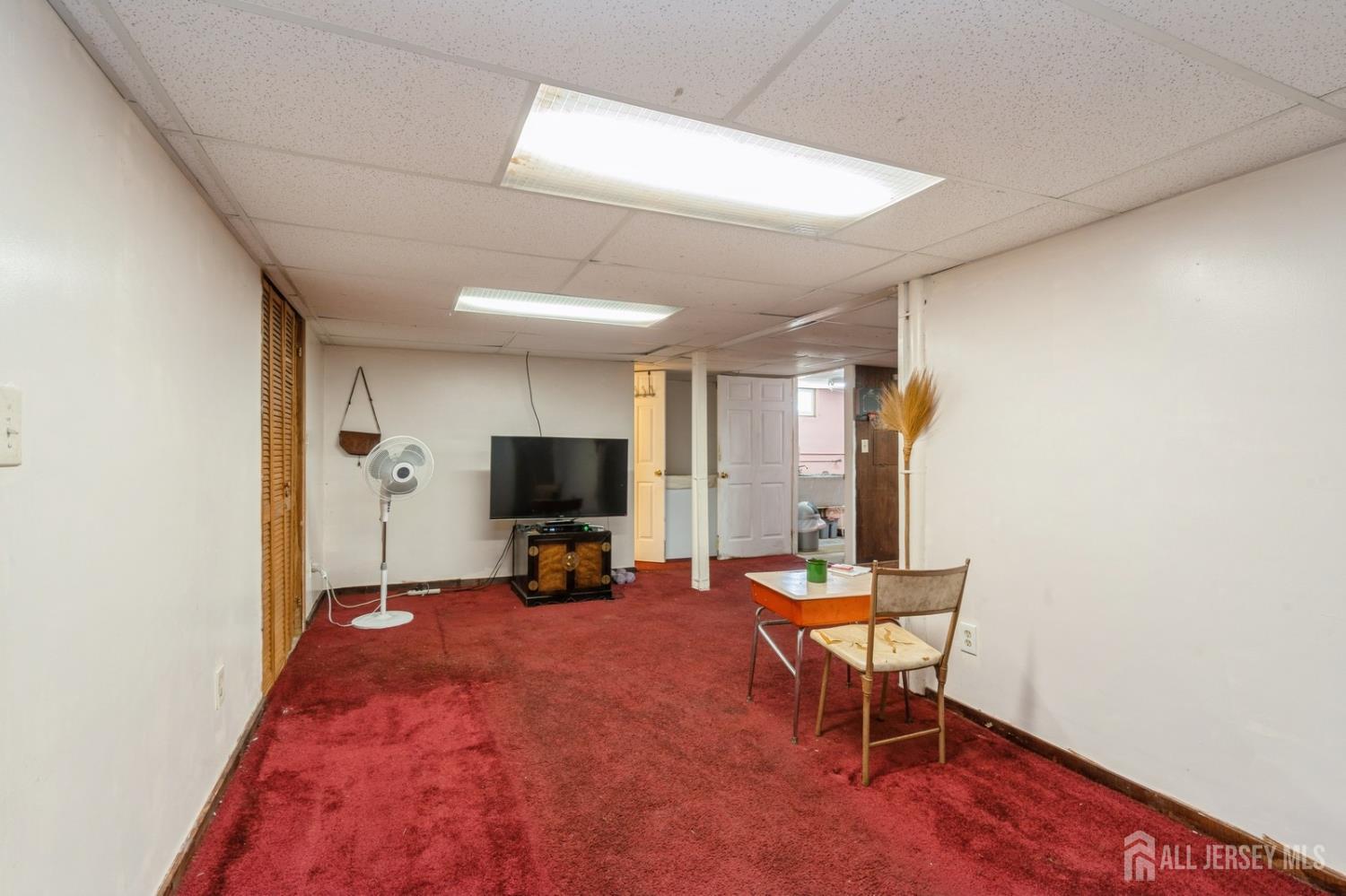 571 Greenbrook Road North Plainfield, NJ 07063 - Photo 23 of 28 a room with furniture and a flat screen tv