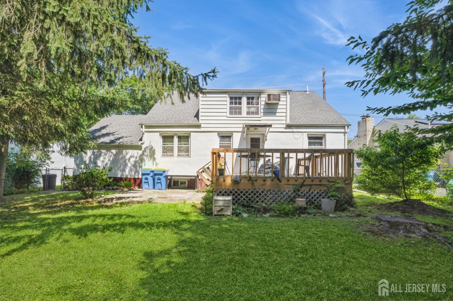 571 Greenbrook Road North Plainfield, NJ 07063 - Photo 5 of 28 a front view of a house with a garden
